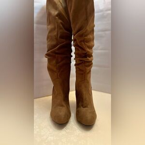 Women’s 3” heeled thigh high suede look boot.